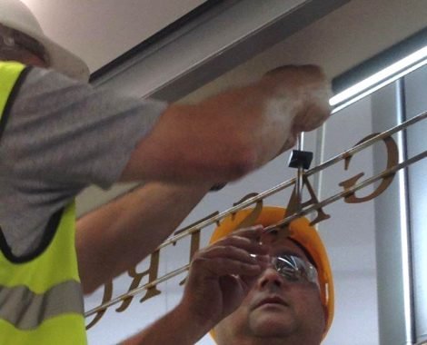 Installing Caviar House Heathrow Signs